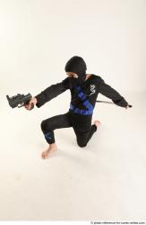 VLASTIMIL KNEELING POSE WITH GUN